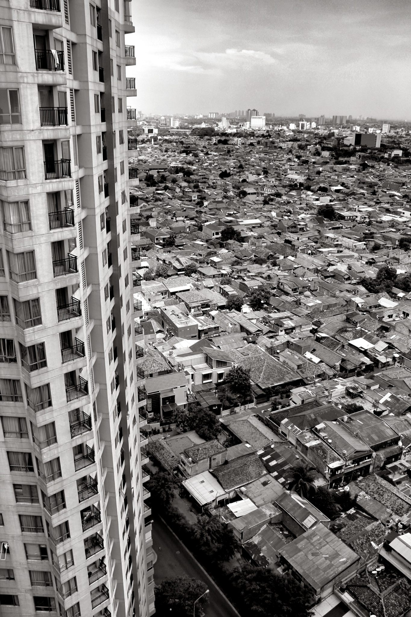 High rise towering over slum